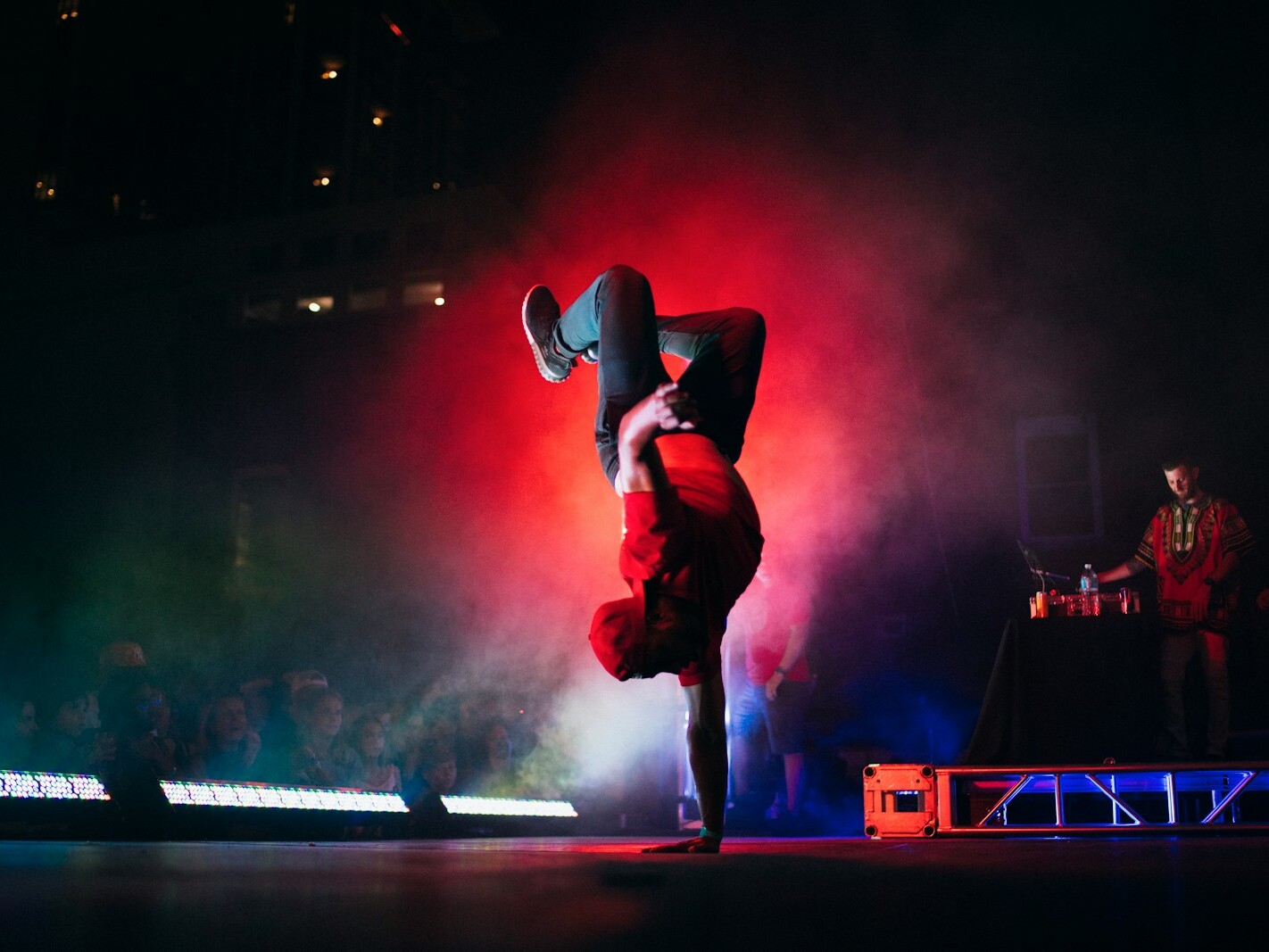 man doing breakdancing on gray surface